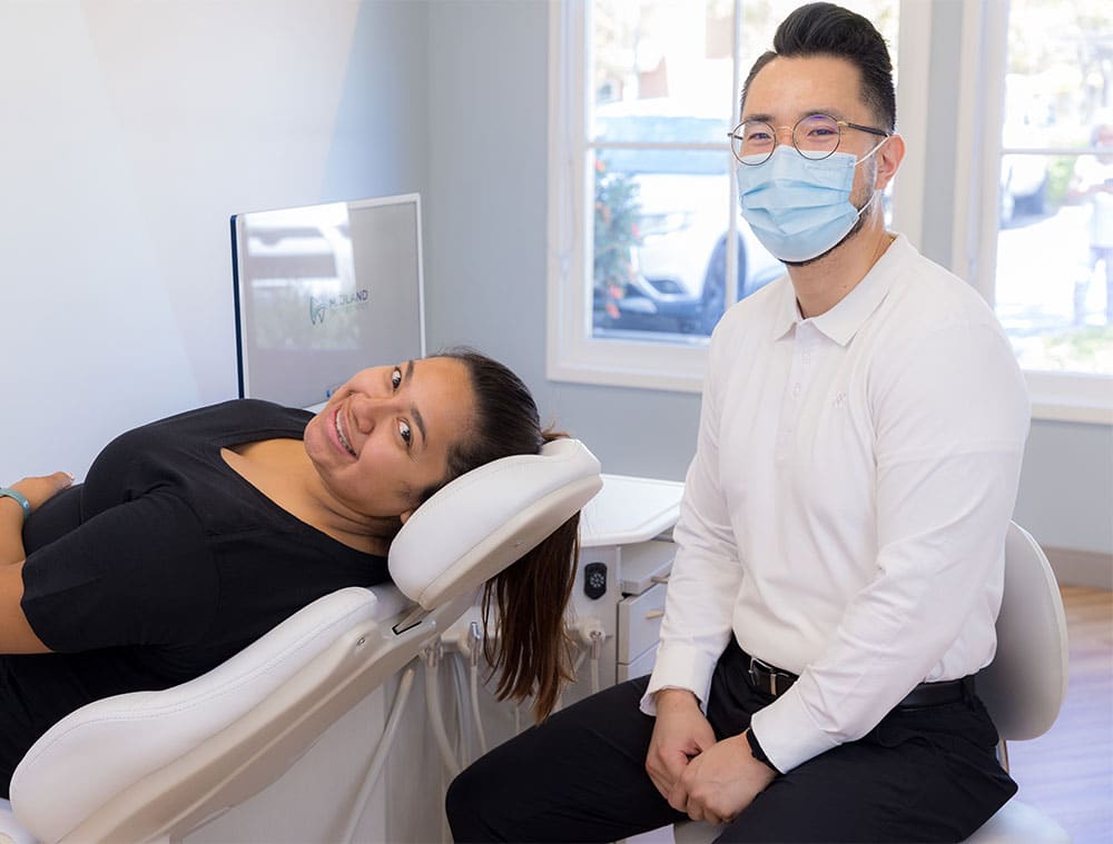 Dr. Yoo smiling with a patient